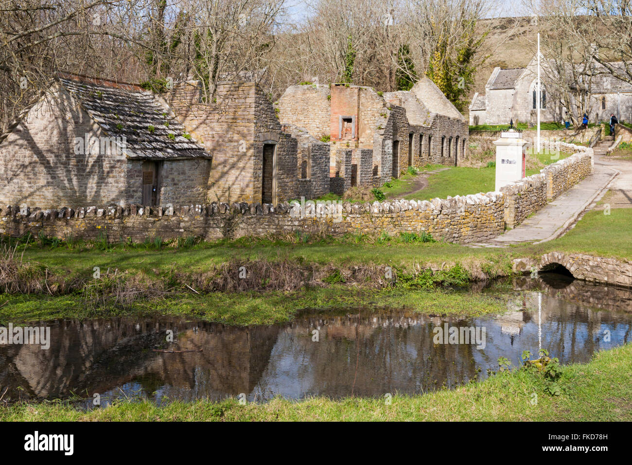 Pond and ruins of abandoned buildings at Tyneham Village, Dorset UK in