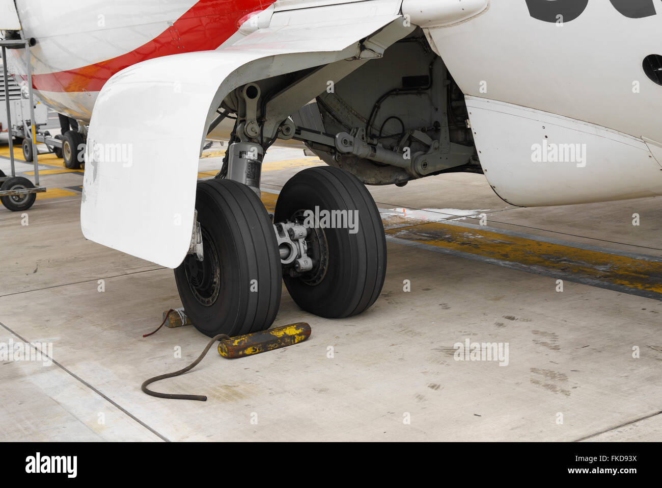 Wheel chocks deployed on an airplanes landing gear Stock Photo