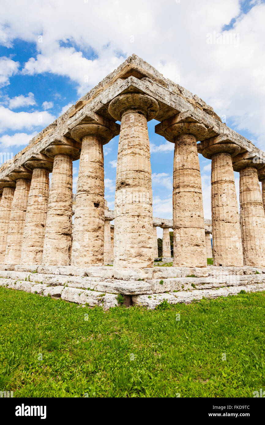 Old architectural columns of Paestum ruins on grass Stock Photo