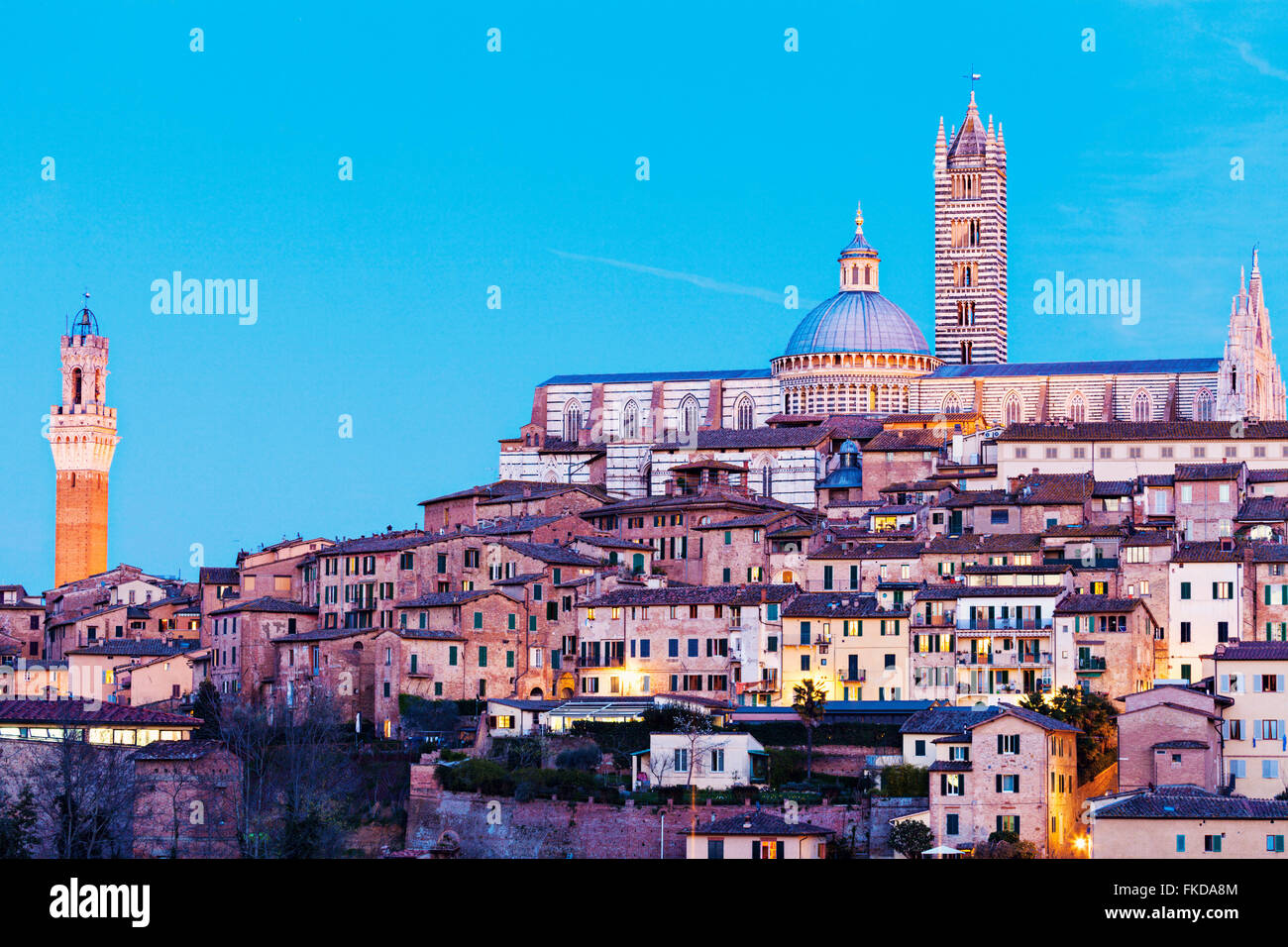 Townscape with Siena Cathedral against sky Stock Photo