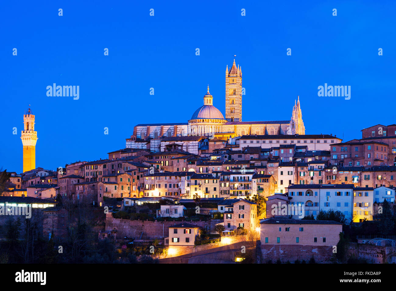 Townscape with Siena Cathedral at dusk Stock Photo