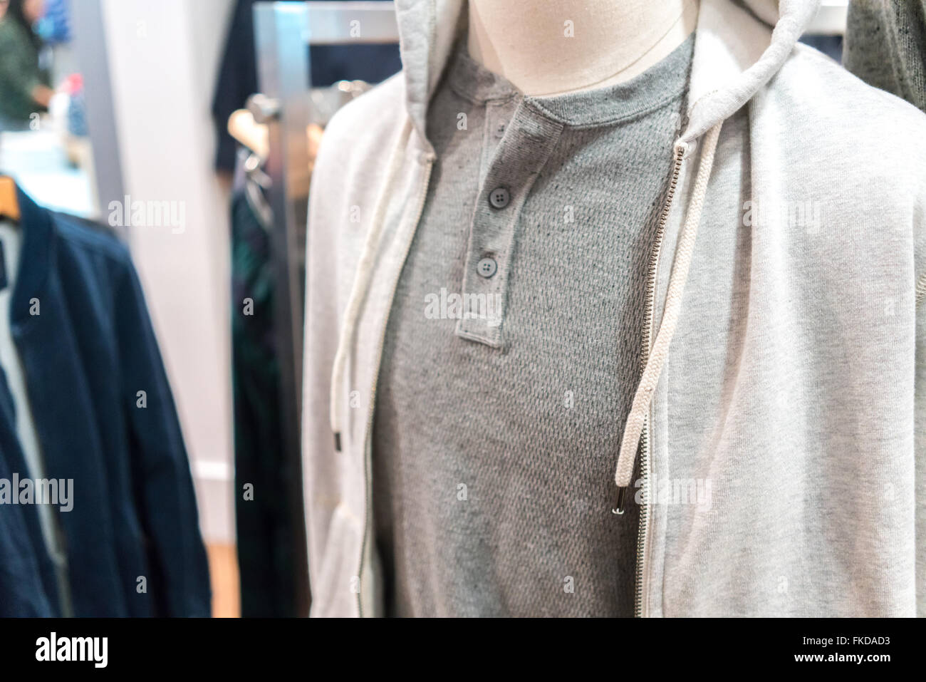 Mannequin displaying hood clothing in clothes store Stock Photo