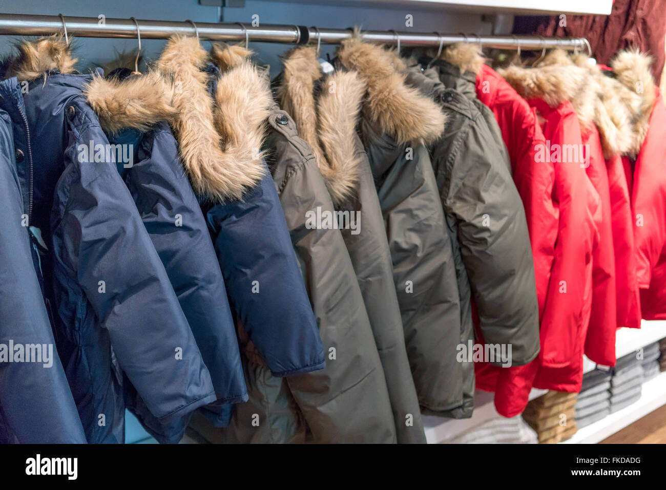 Rail of fur coats hanging in clothes shop Stock Photo Alamy