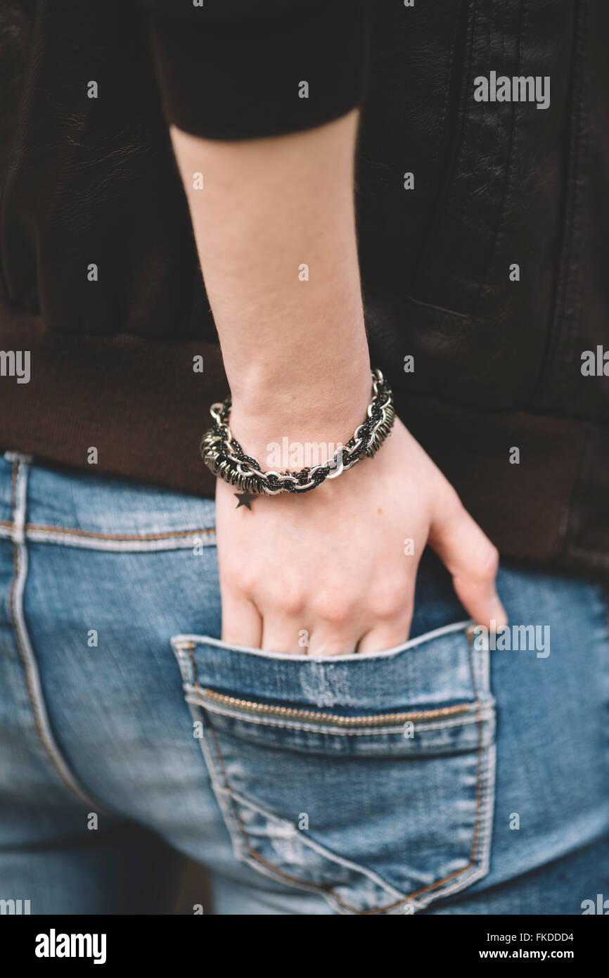 hand of the young female  in jeans pocket Stock Photo