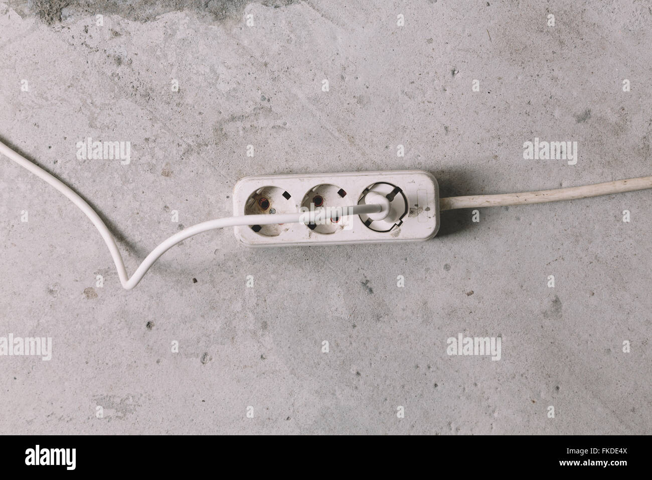 electric extension cable on grey background Stock Photo Alamy