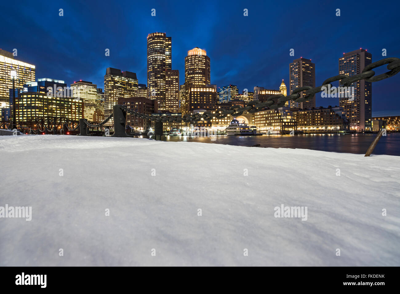 Illuminated buildings by canal Stock Photo