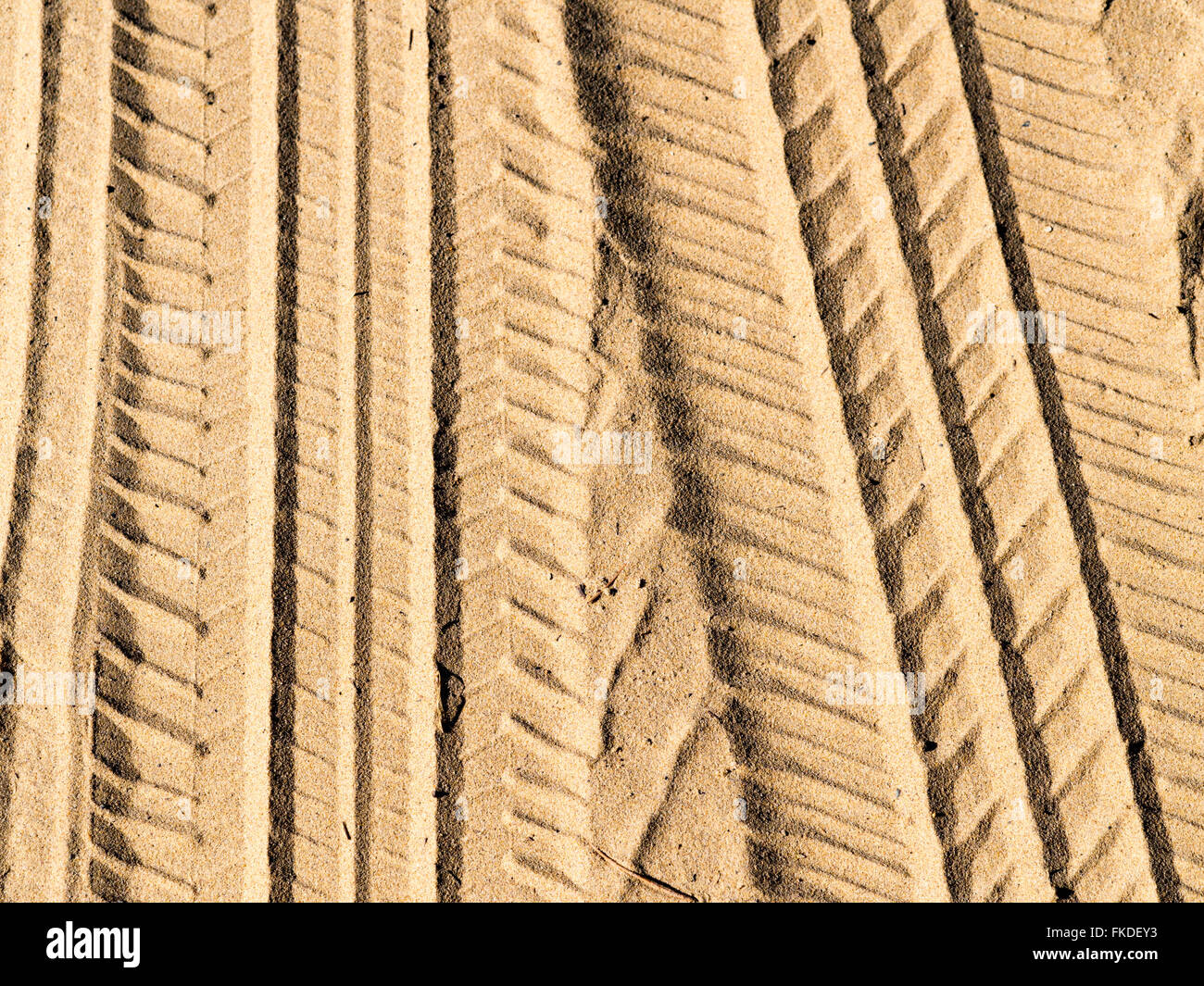Tire tracks in sand Stock Photo