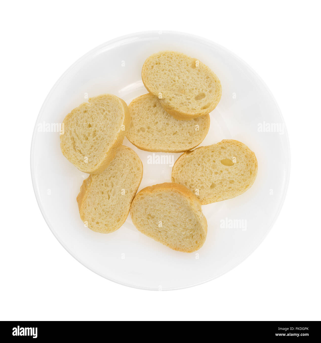 Top view of a plate of sliced French bread isolated on a white ...