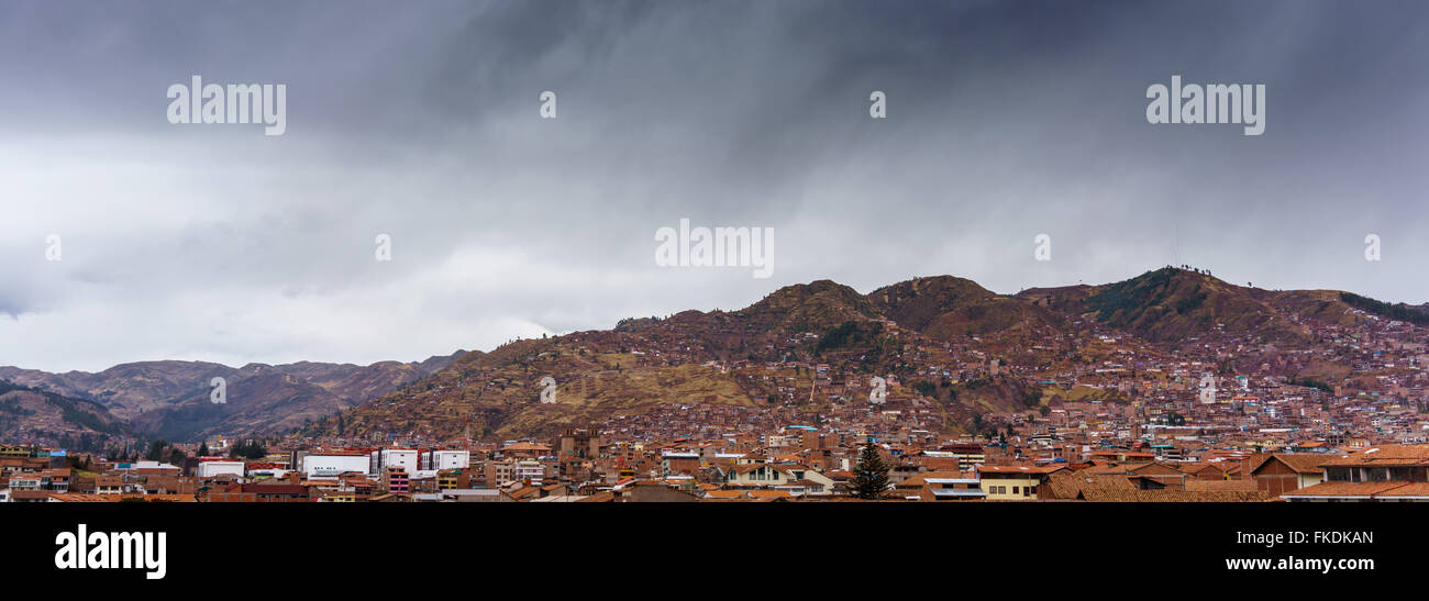 Distant view of city at mountainside, Cusco, Peru Stock Photo