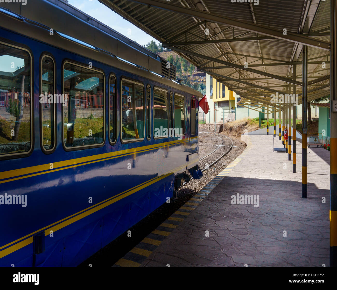 Blue passenger train on railway station, Cusco, Peru Stock Photo