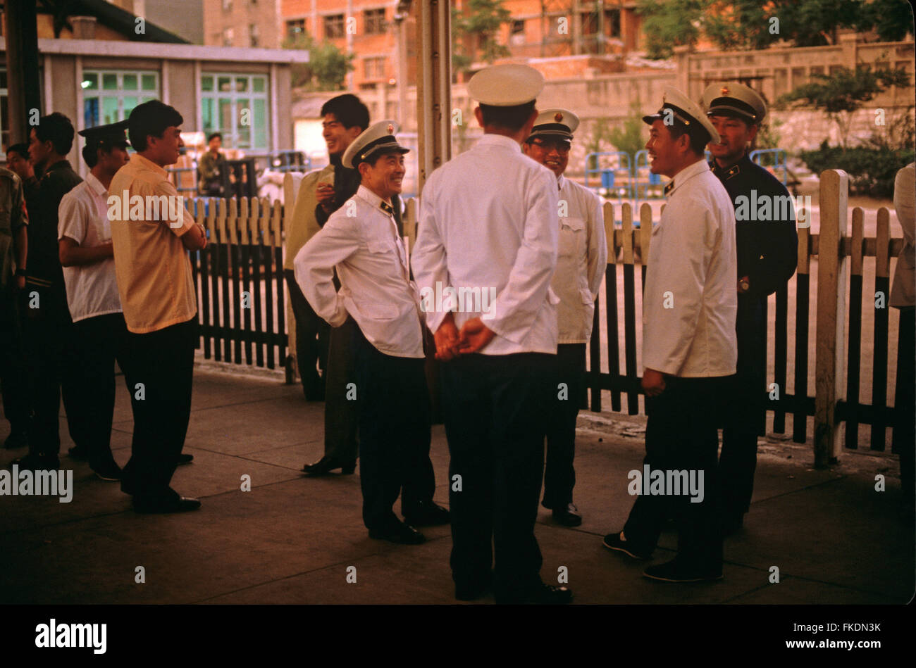 Military personnel at Qingdao railway station, Shandong Province, China, 1980s Stock Photo