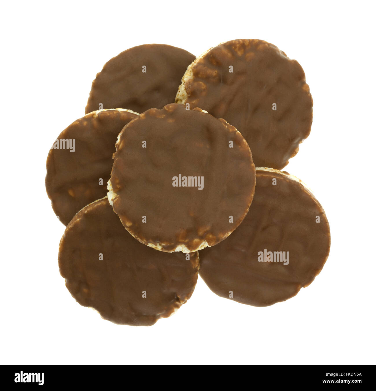 Top view of a group of organic rice cookies with milk chocolate icing isolated on a white background. Stock Photo