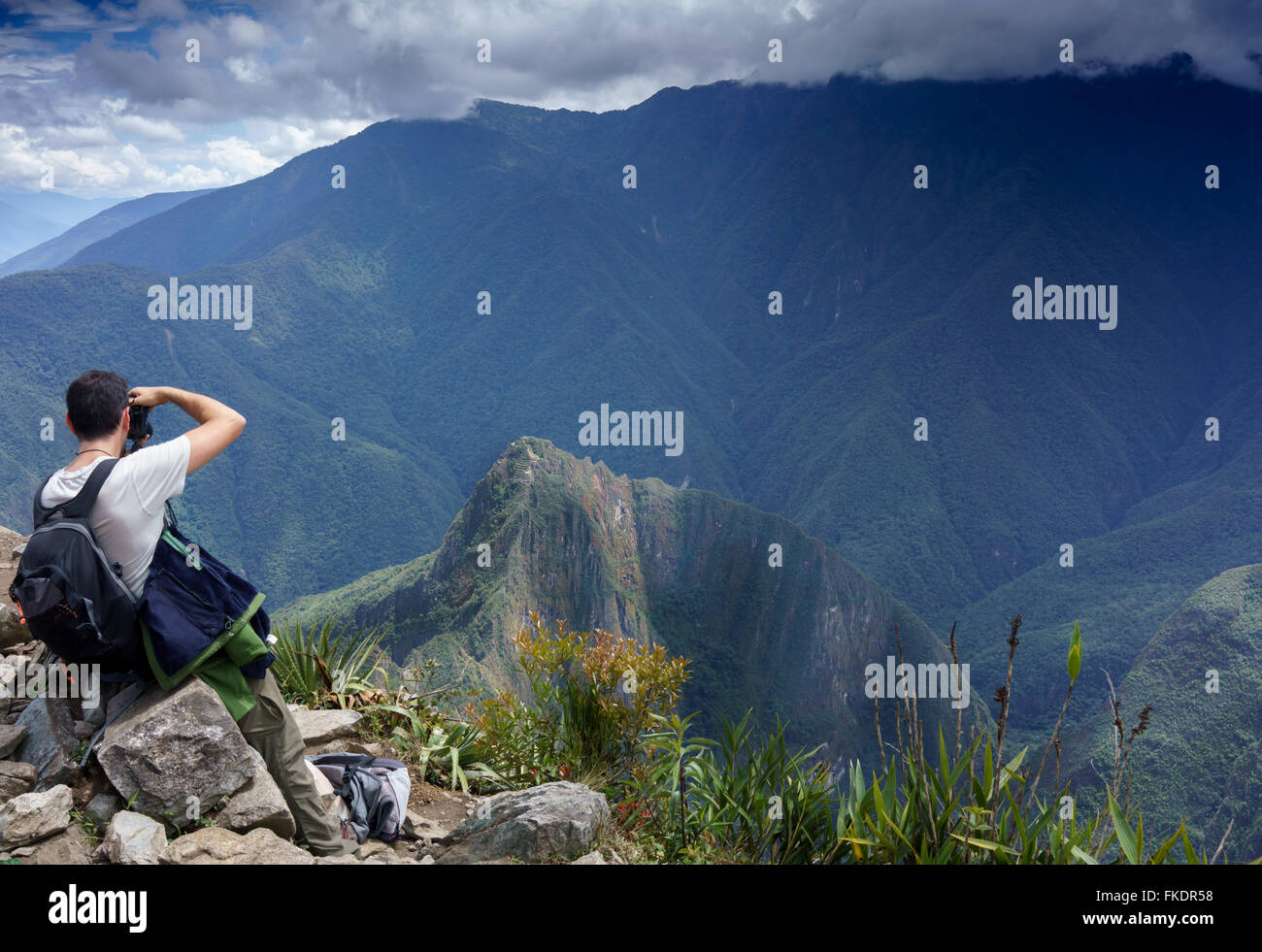 Rear view of a photographer taking picture of Machu Picchu, Cusco Region, Urubamba Province, Machupicchu District, Peru Stock Photo