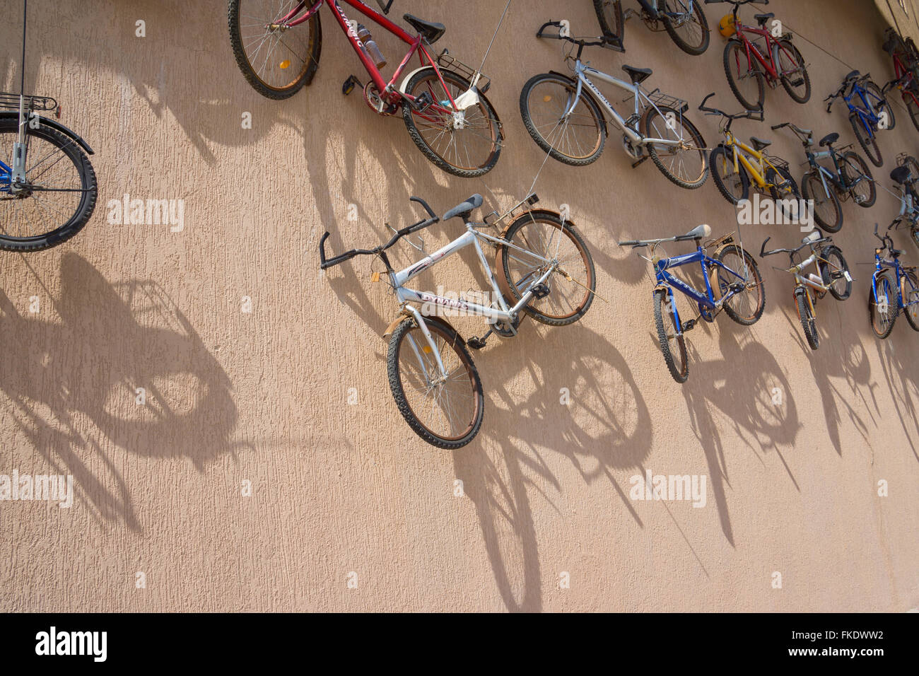 Old bikes hanging on a wall Stock Photo Alamy