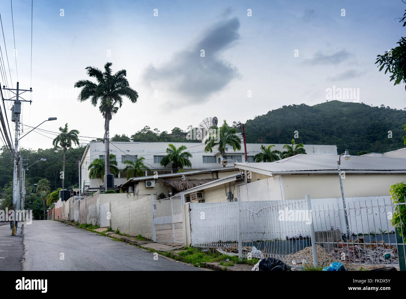 Houses along road against sky, Trinidad, Trinidad And Tobago Stock Photo