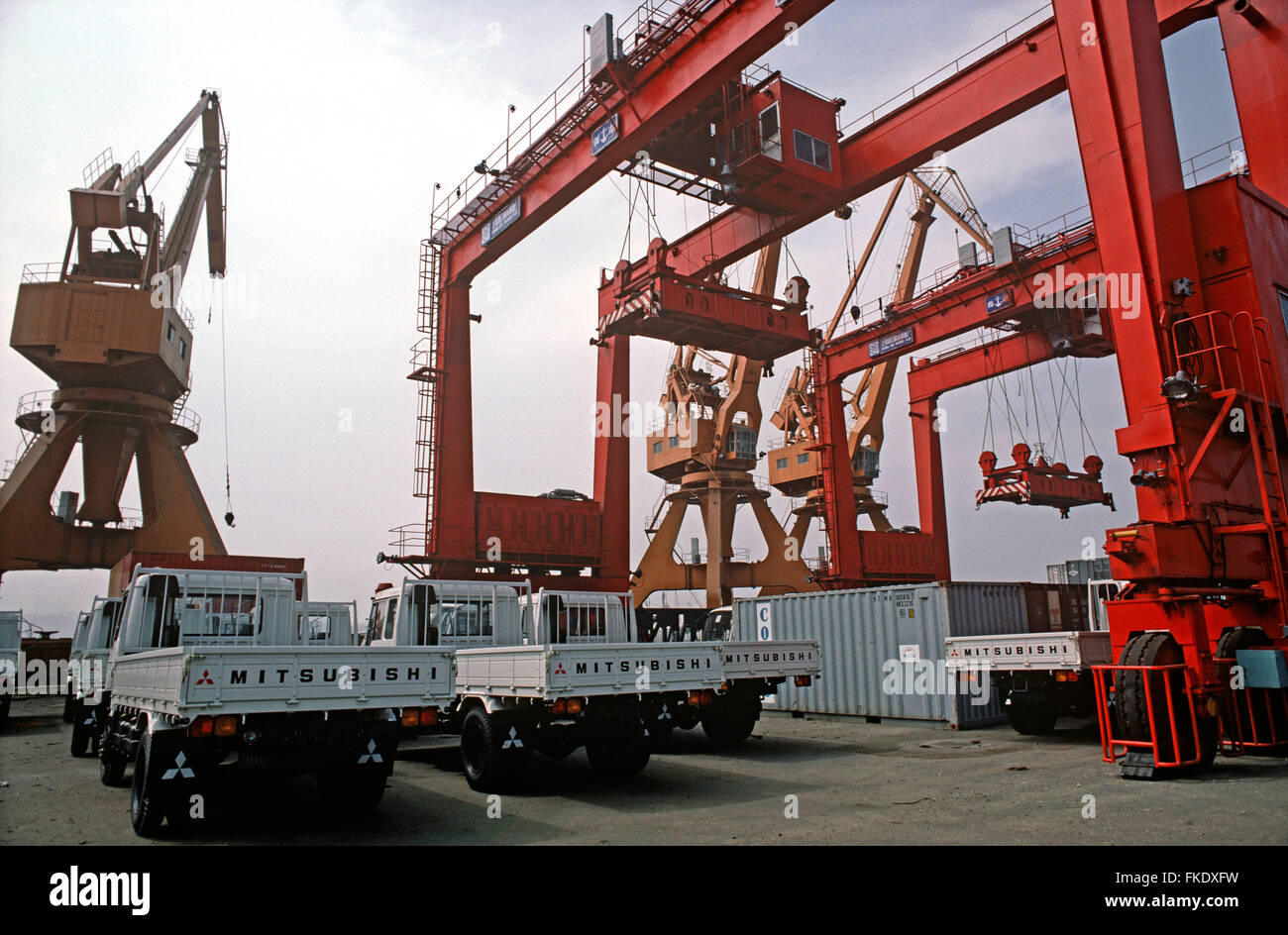 New Mitsubishi trucks being unloaded at Qingdao port, Shandong Province, China Stock Photo