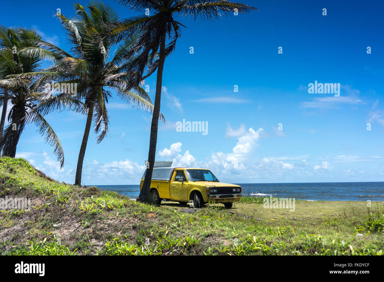 Pick up truck on beach, Trinidad, Trinidad and Tobago Stock Photo