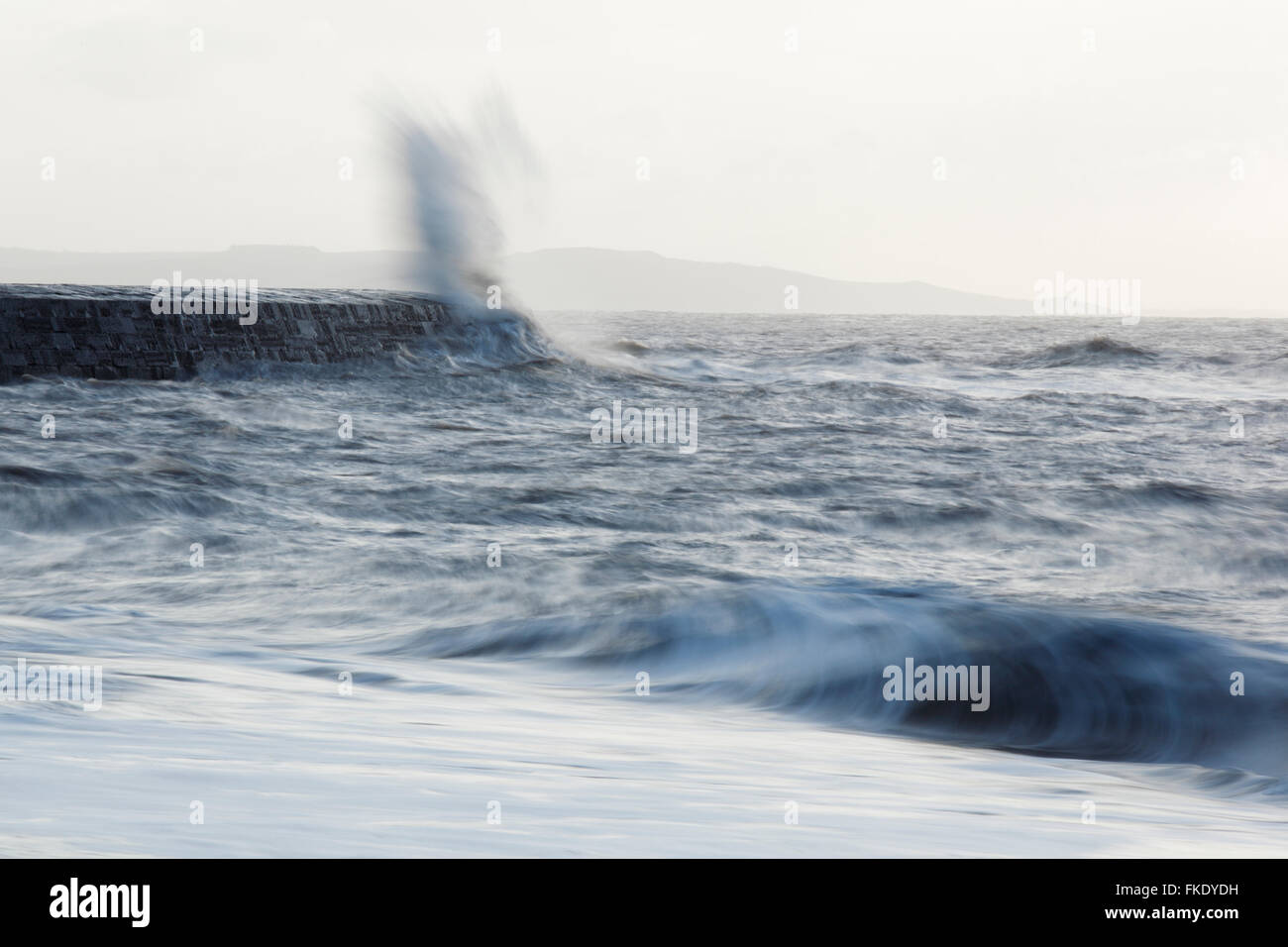 Rough seas crashing against The Cobb harbour wall. Lyme Regis. Dorset. UK. Stock Photo