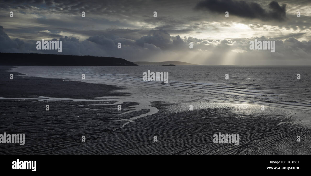 Incoming Tide at Sand Bay. Birnbeck Pier in the distance, Brean Down in the far distance. Somerset. UK. Stock Photo