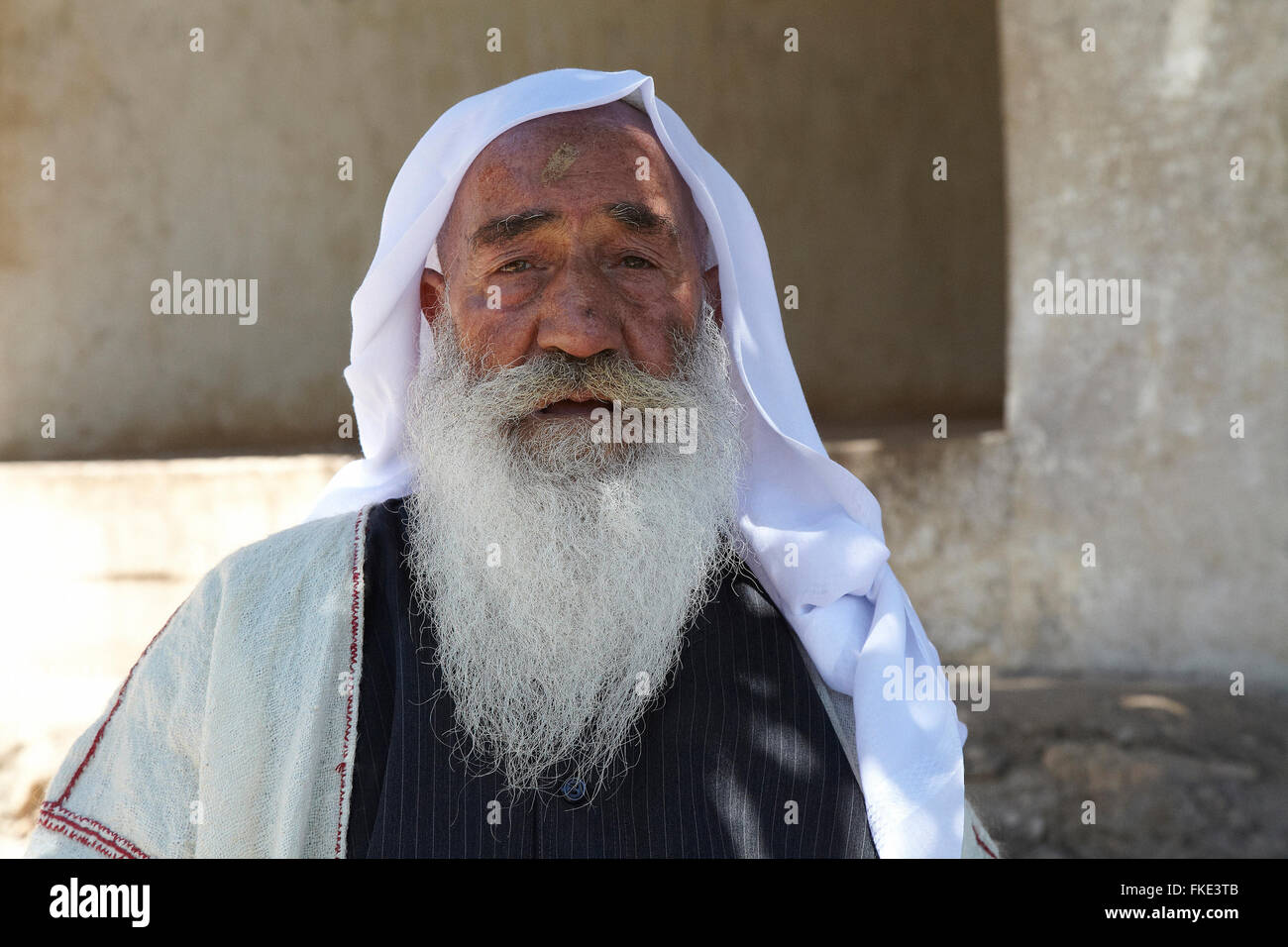 A Yazidi or Yezidi refugee man in the holy temple of Lalesh in Iraqi Kurdistan. Stock Photo