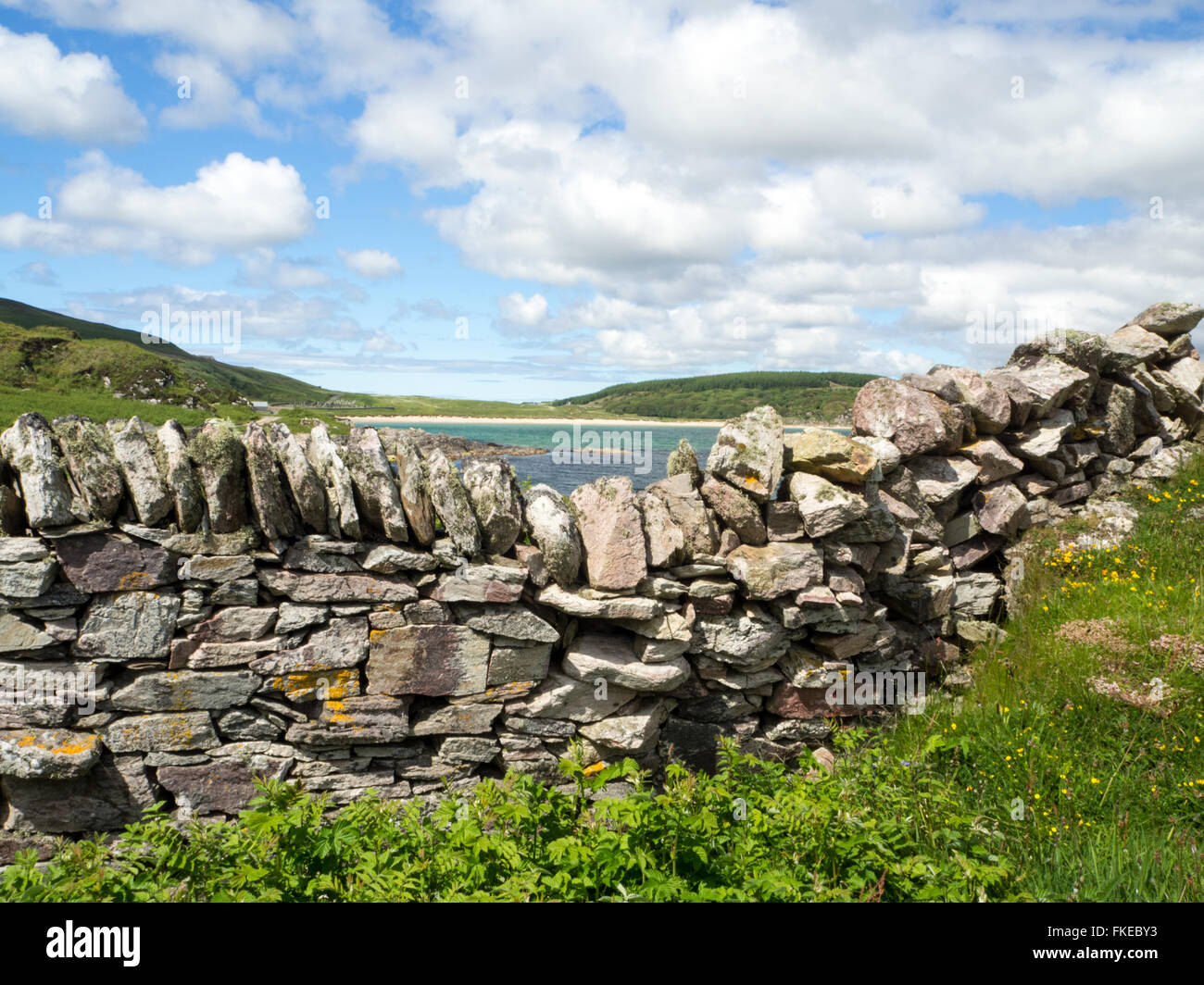 Dry Stane dyke and Kilnaughton Bay, Isle of Islay Inner Hebrides Scotland Stock Photo