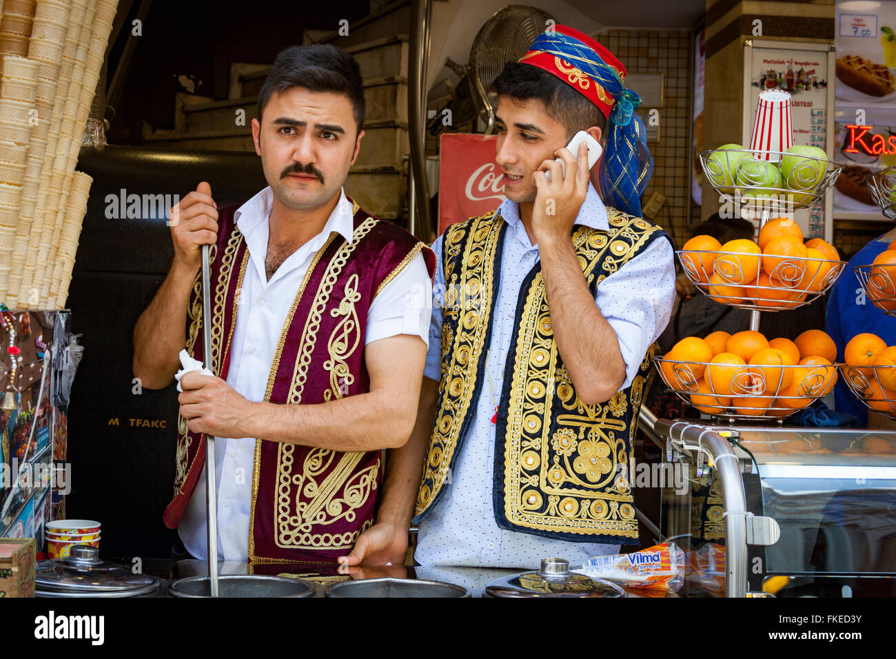 Two shop assistants wearing traditional costume, Istanbul, Turkey Stock Photo