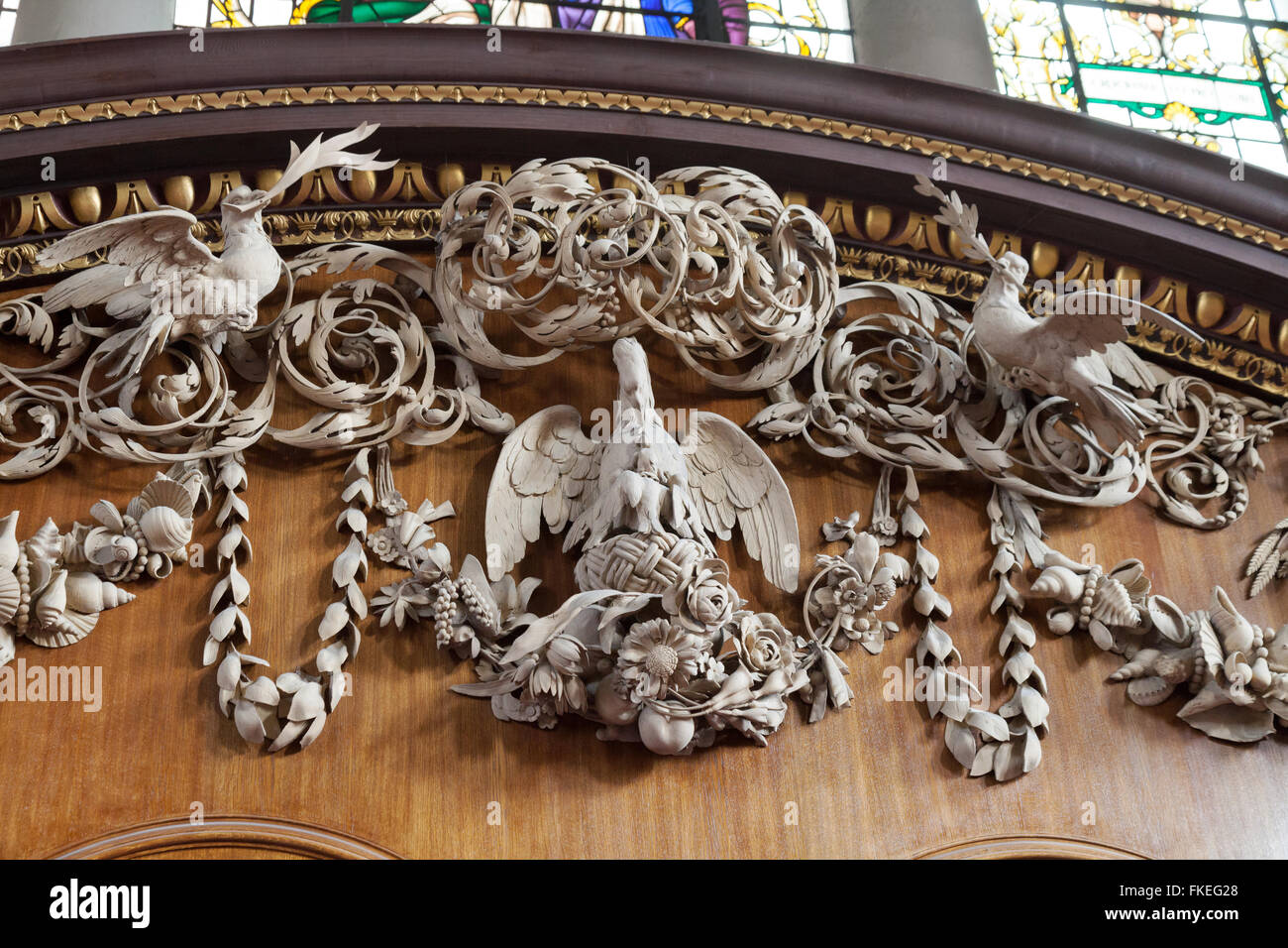 Close up detail of wood carving by Grinling Gibbons sculptor and wood carver; the altar, St James Church interior, Piccadilly London UK Stock Photo