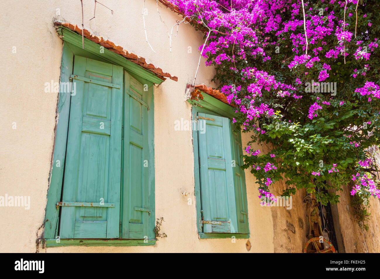 Green window shutters on a house in the town of Chios, Chios, Greece Stock Photo