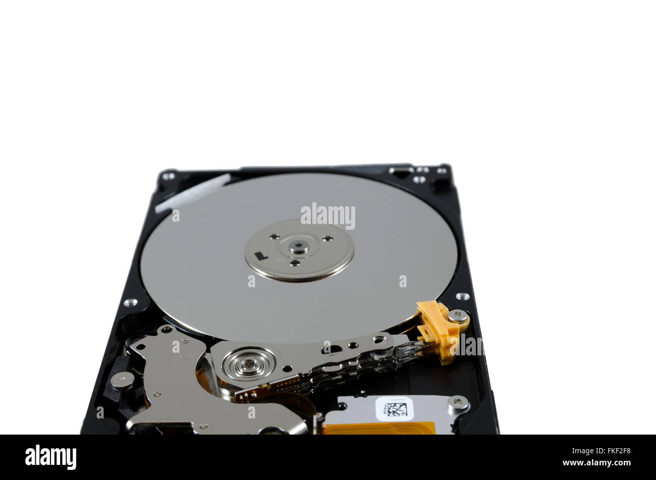 Picture of a hard disk without cover showing the read and write mechanism. Stock Photo