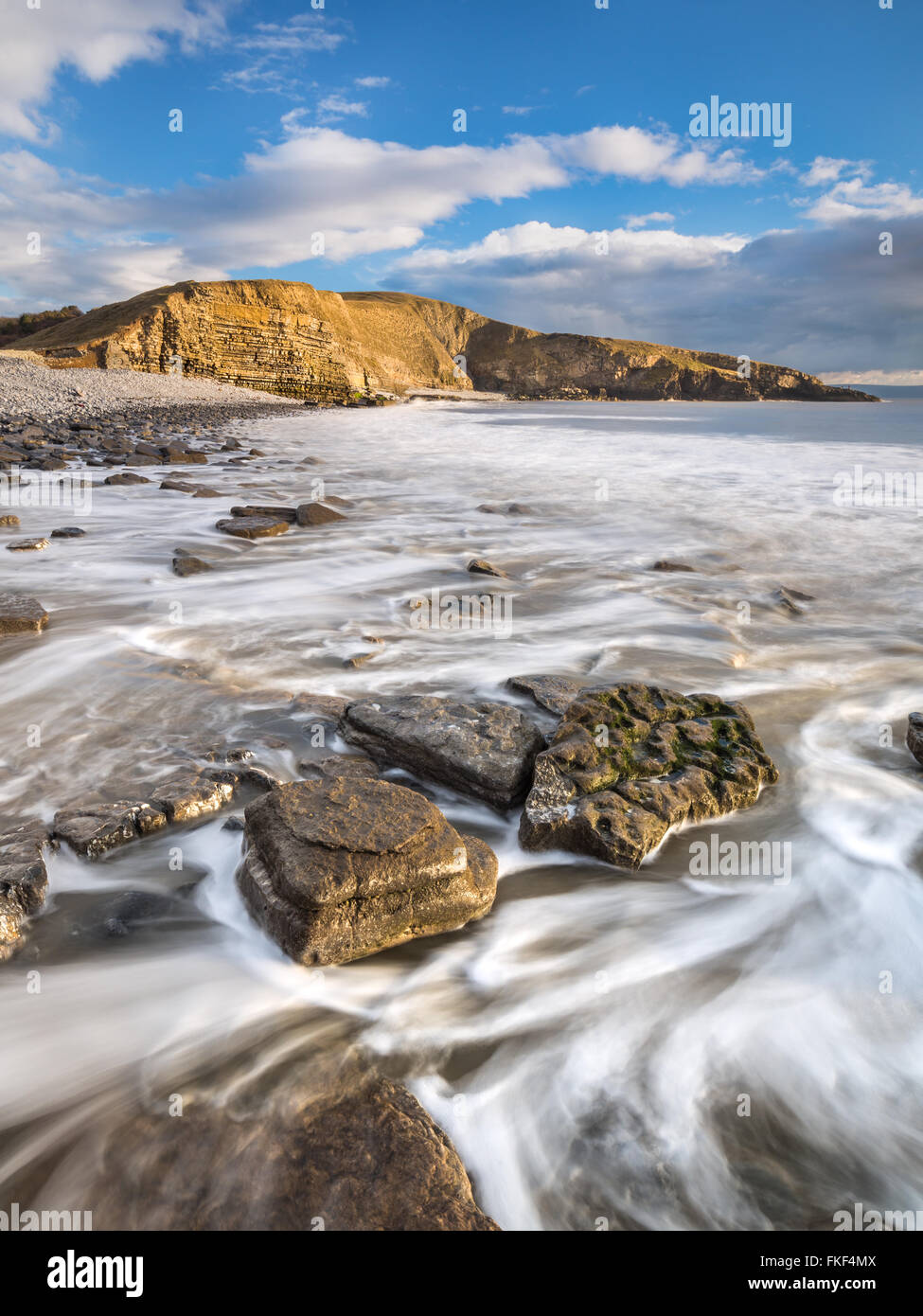 Evening light just after high tide at Dunraven Bay on the south Wales heritage coast in Glamorgan Stock Photo