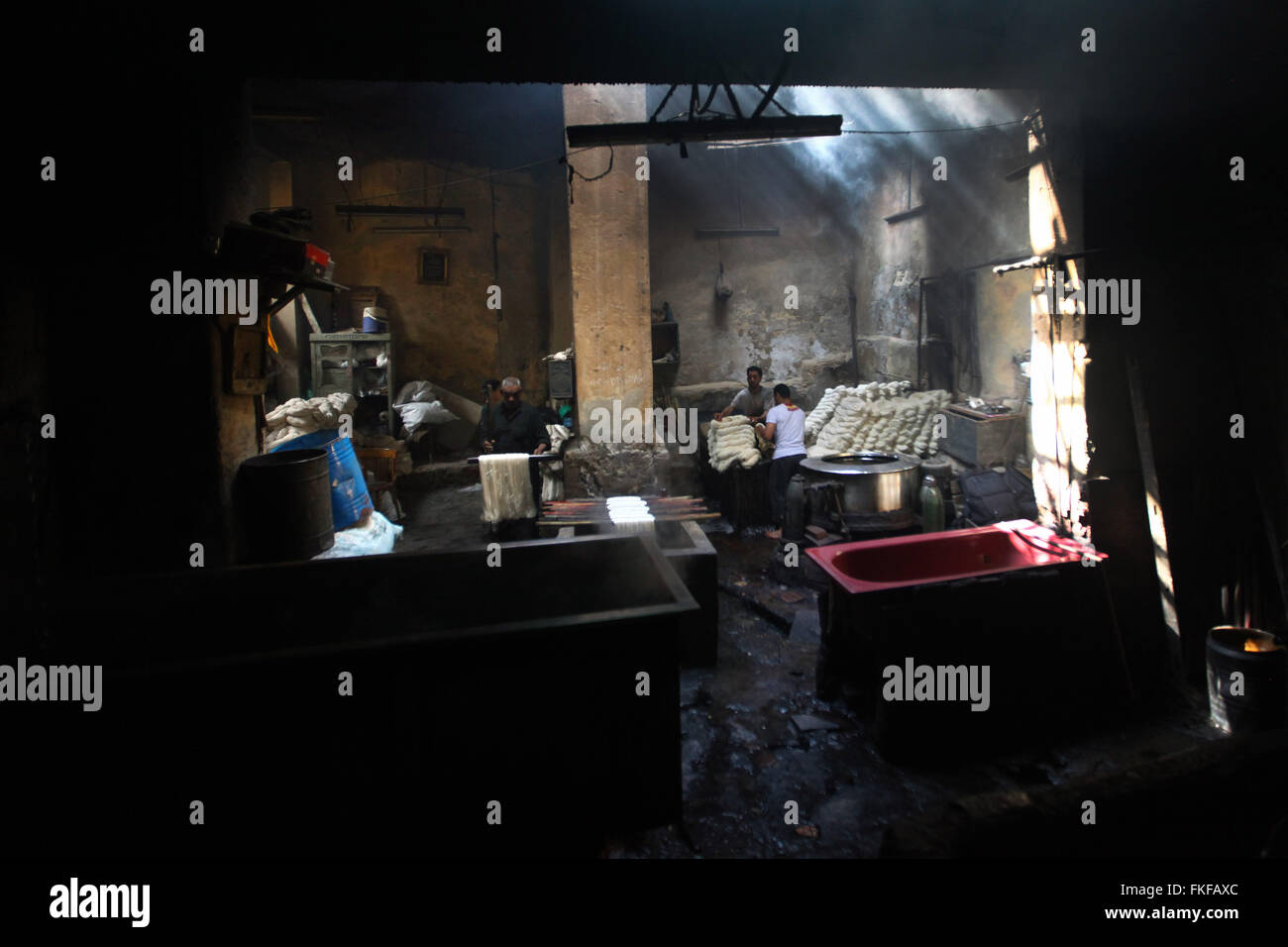 Cairo. 8th Mar, 2016. Workers process yarn at a dyeing factory at Al
