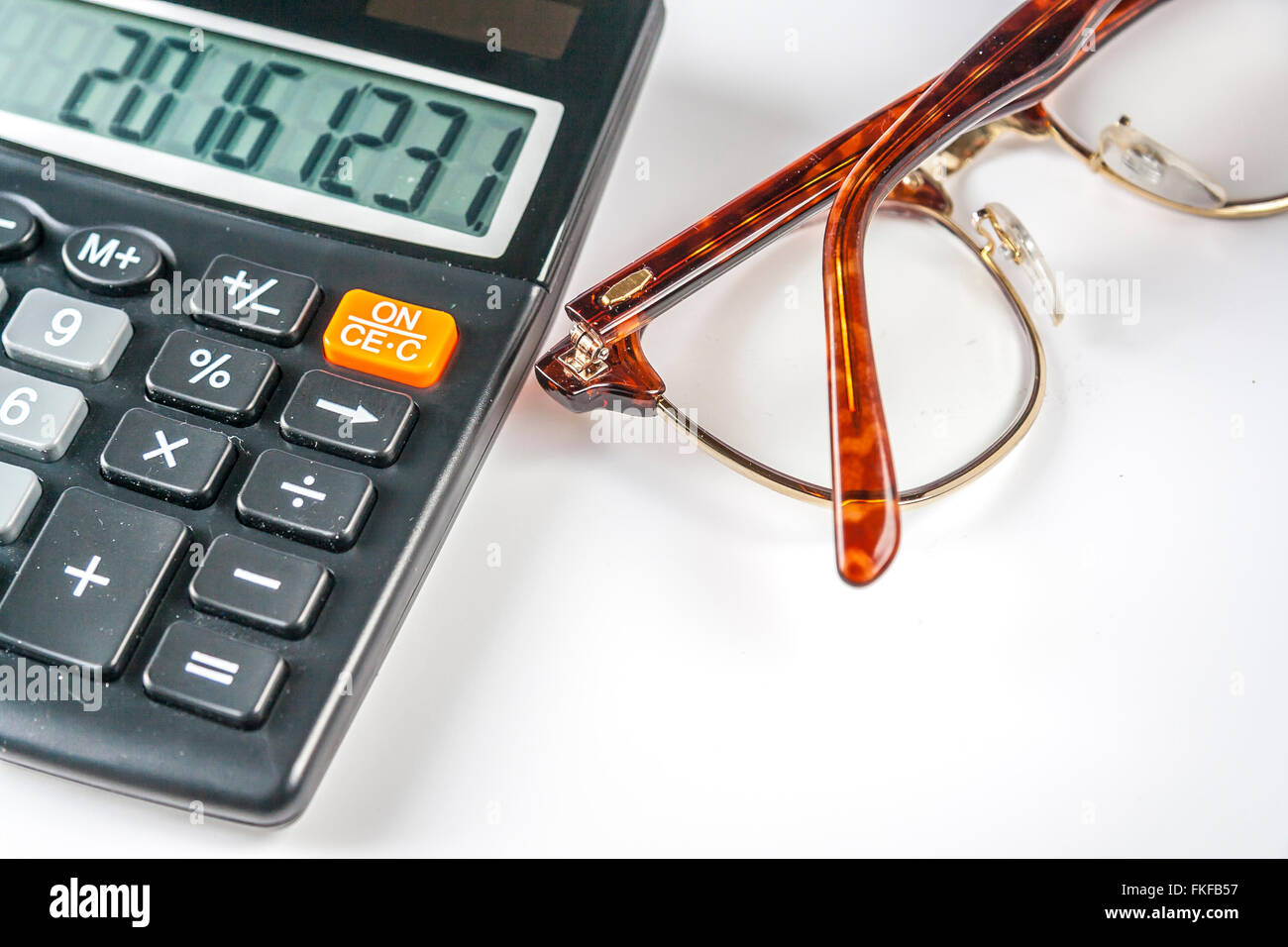 Calculator And Eyeglasses Stock Photo Alamy