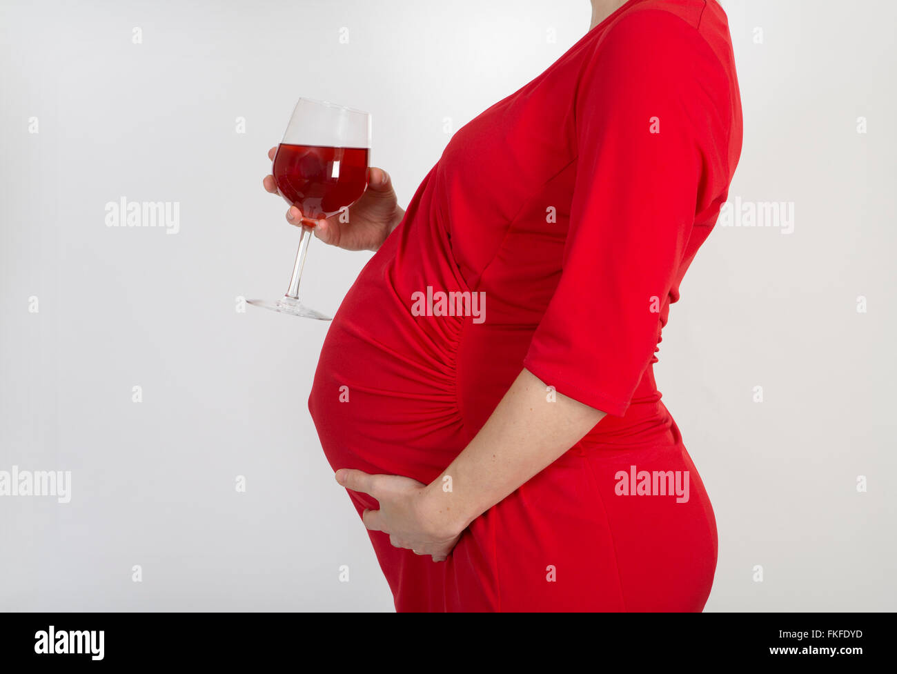 Pregnant lady with alcohol. Stock Photo