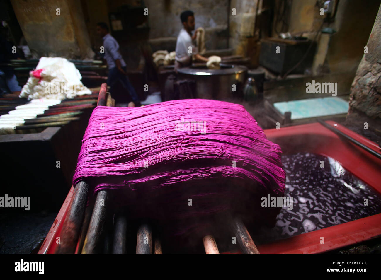 Cairo. 8th Mar, 2016. Workers process yarn at a dyeing factory at Al