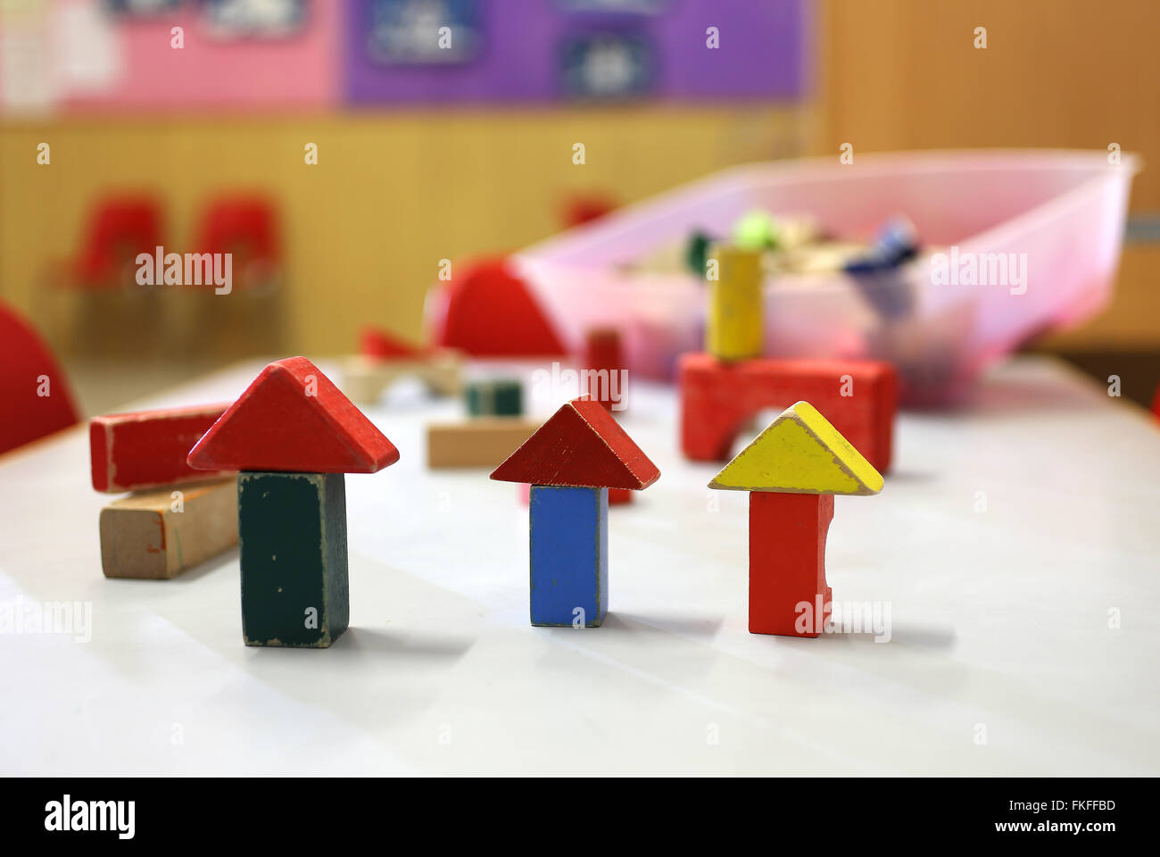 many wooden toys and pieces of buildings in the nursery class Stock Photo