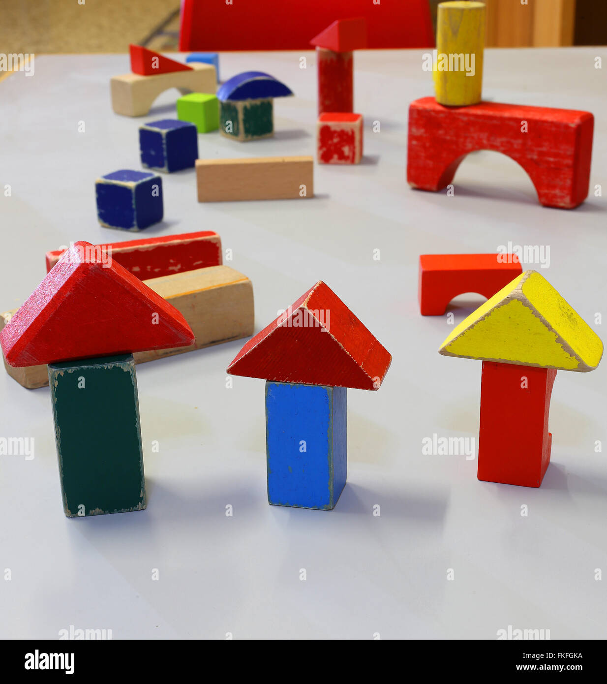 many toys and little wooden pieces of buildings in the kindergarten Stock Photo