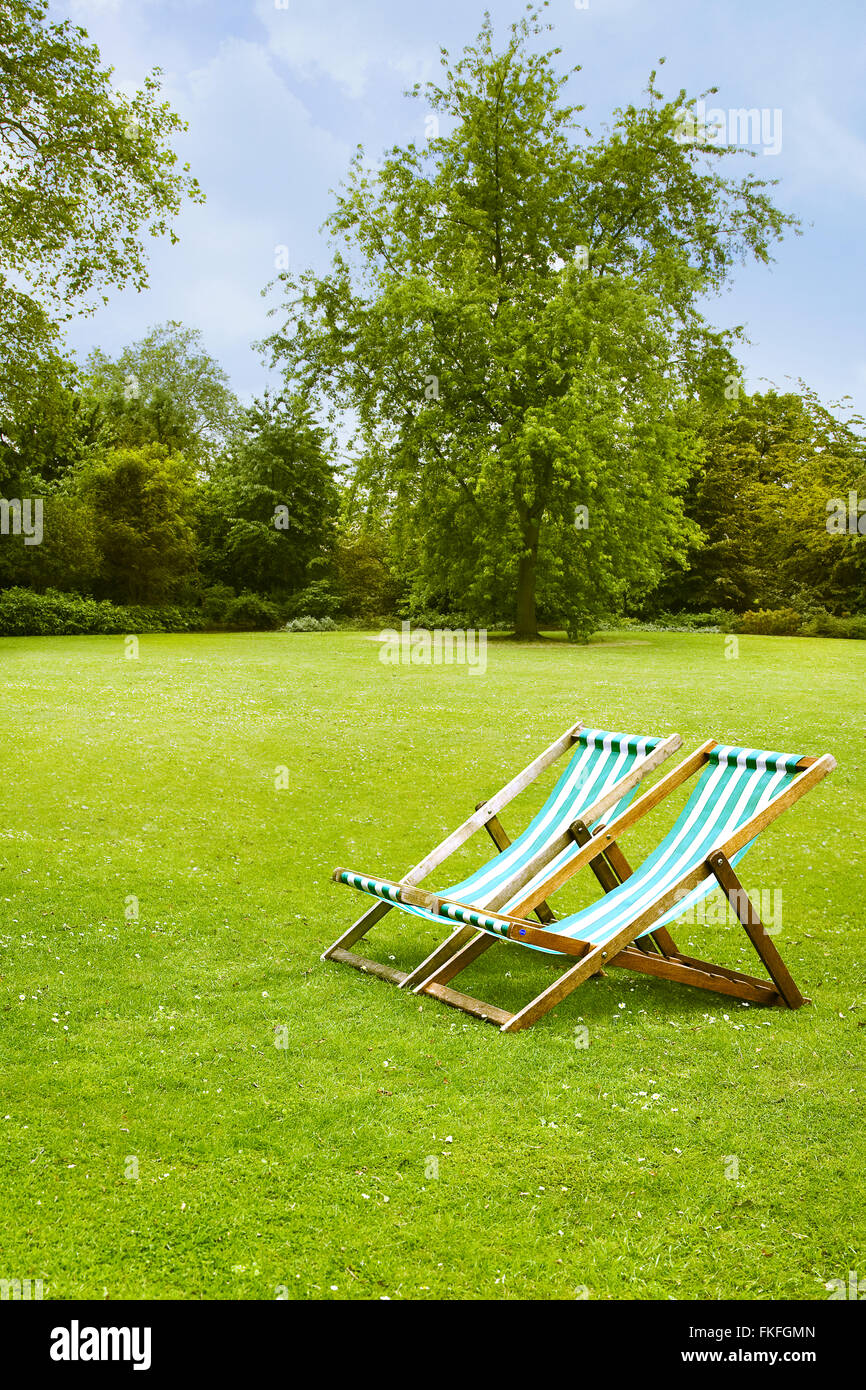Deck chairs in the park Stock Photo - Alamy
