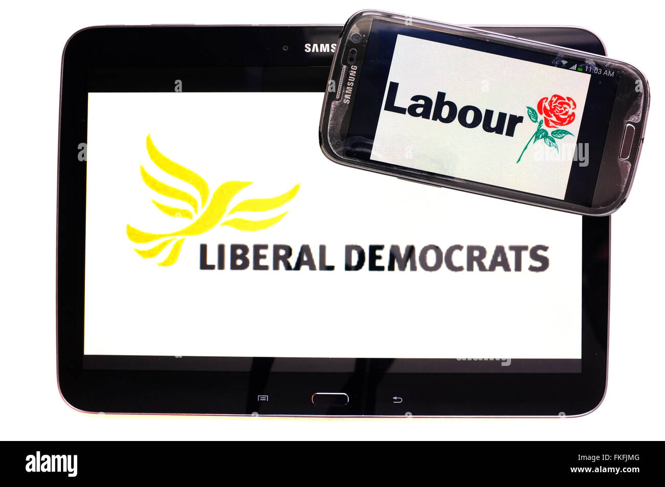 A tablet with the Lib Dem logo on it and a smartphone with the Labour ...