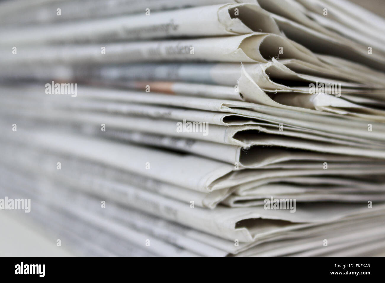 stacked old newspapers pile of newspapers Stock Photo - Alamy