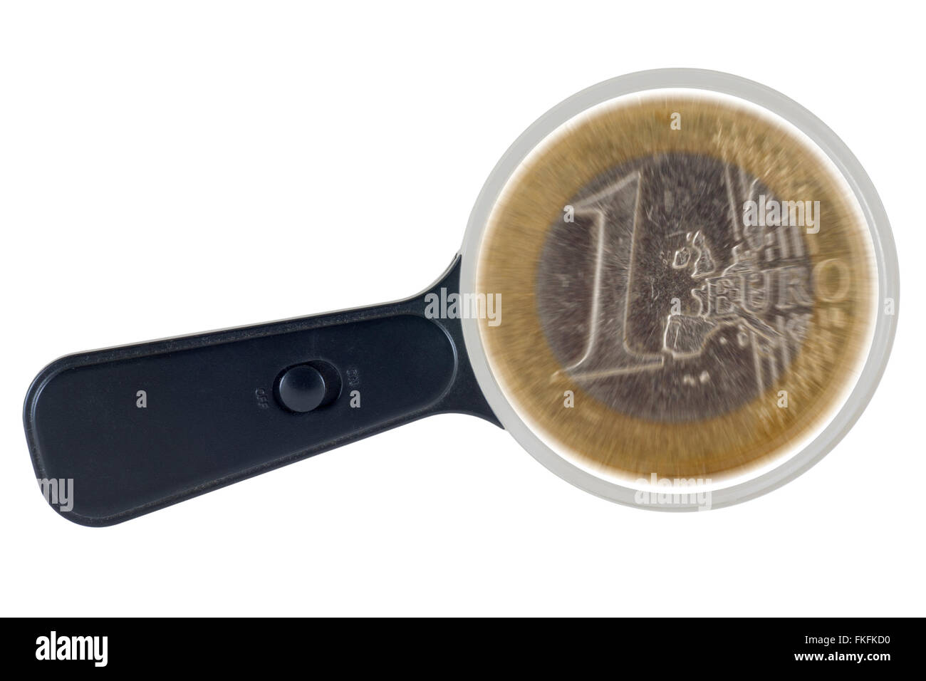 Euro coin under magnifying glass. Clipping path. Economic speculation. Stock Photo