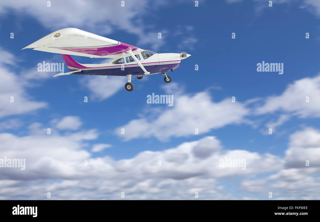 The Cessna 172 Single Propeller Airplane Flying In The Sky. Stock Photo