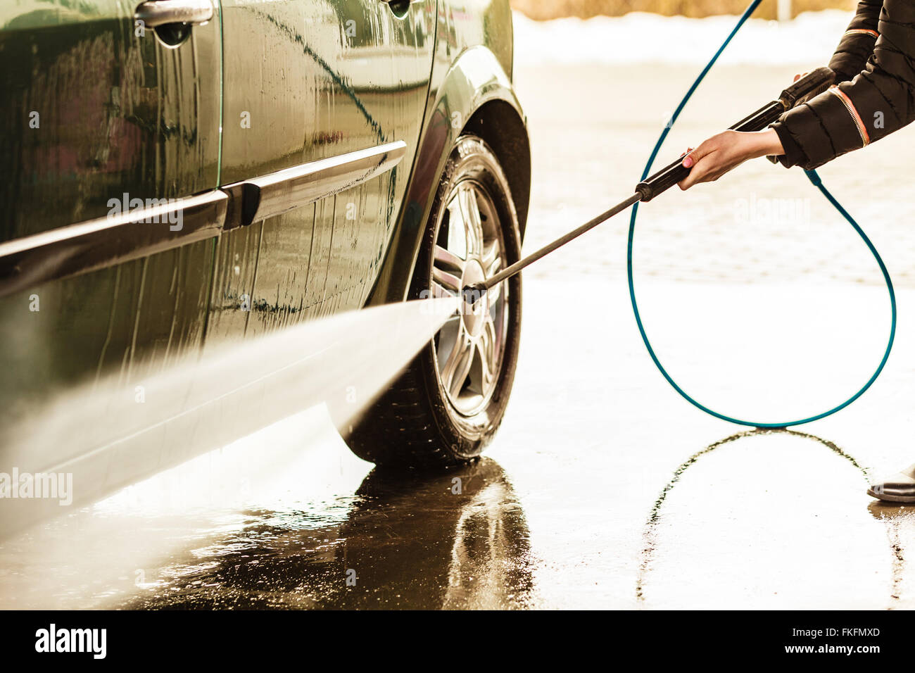 Manual auto wash. dirty car during washing process with foam and