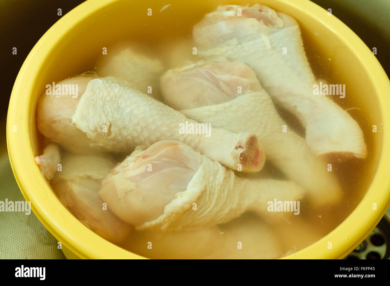 Close up raw chicken meat drumstick in water, washing cleaning and food