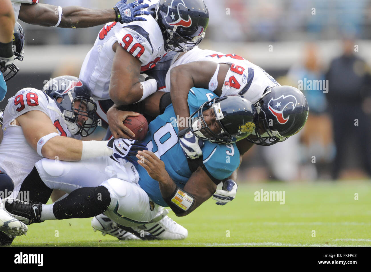 Jacksonville, Florida, UNITED STATES. 6th Dec, 2009. Dec. 6, 2009; Jacksonville, FL, USA; Jacksonville Jaguars quarterback David Garrard (9) is sacked by Houston Texans defensive end Antonio Smith (94), defensive end Mario Williams (90) and defensive end Connor Barwin (98) during their game at Jacksonville Municipal Stadium. ZUMA Press/Scott A. Miller © Scott A. Miller/ZUMA Wire/Alamy Live News Stock Photo
