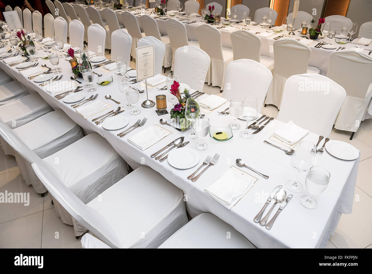 Luxurious table set up with plates and cutlery for dinner reception. Stock Photo