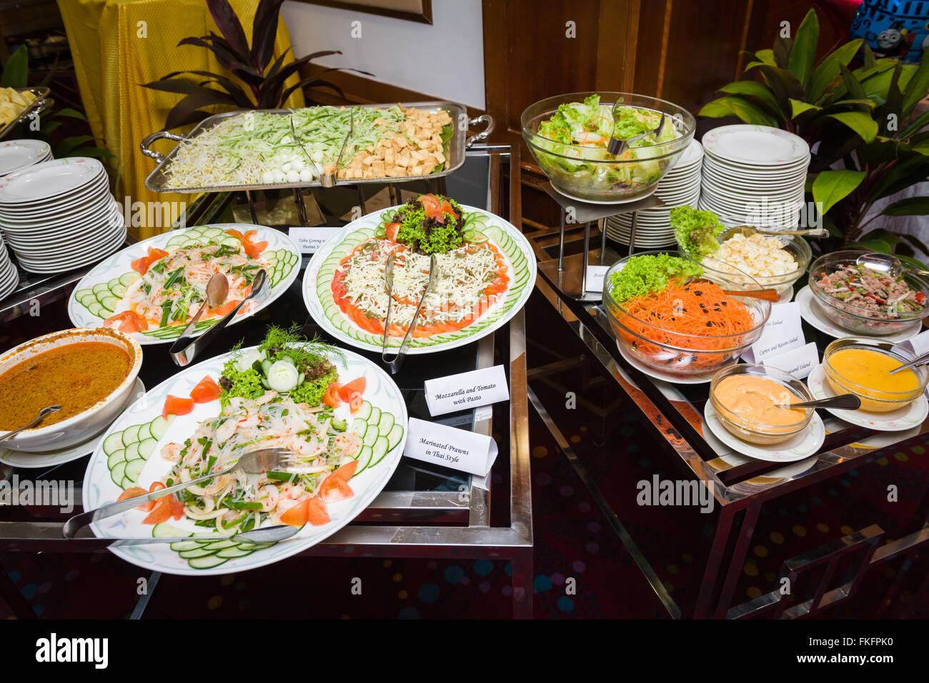 Wide assortment of vegetarian and non-vegetarian salad dishes. Diet and healthy lifestyle concepts. Stock Photo
