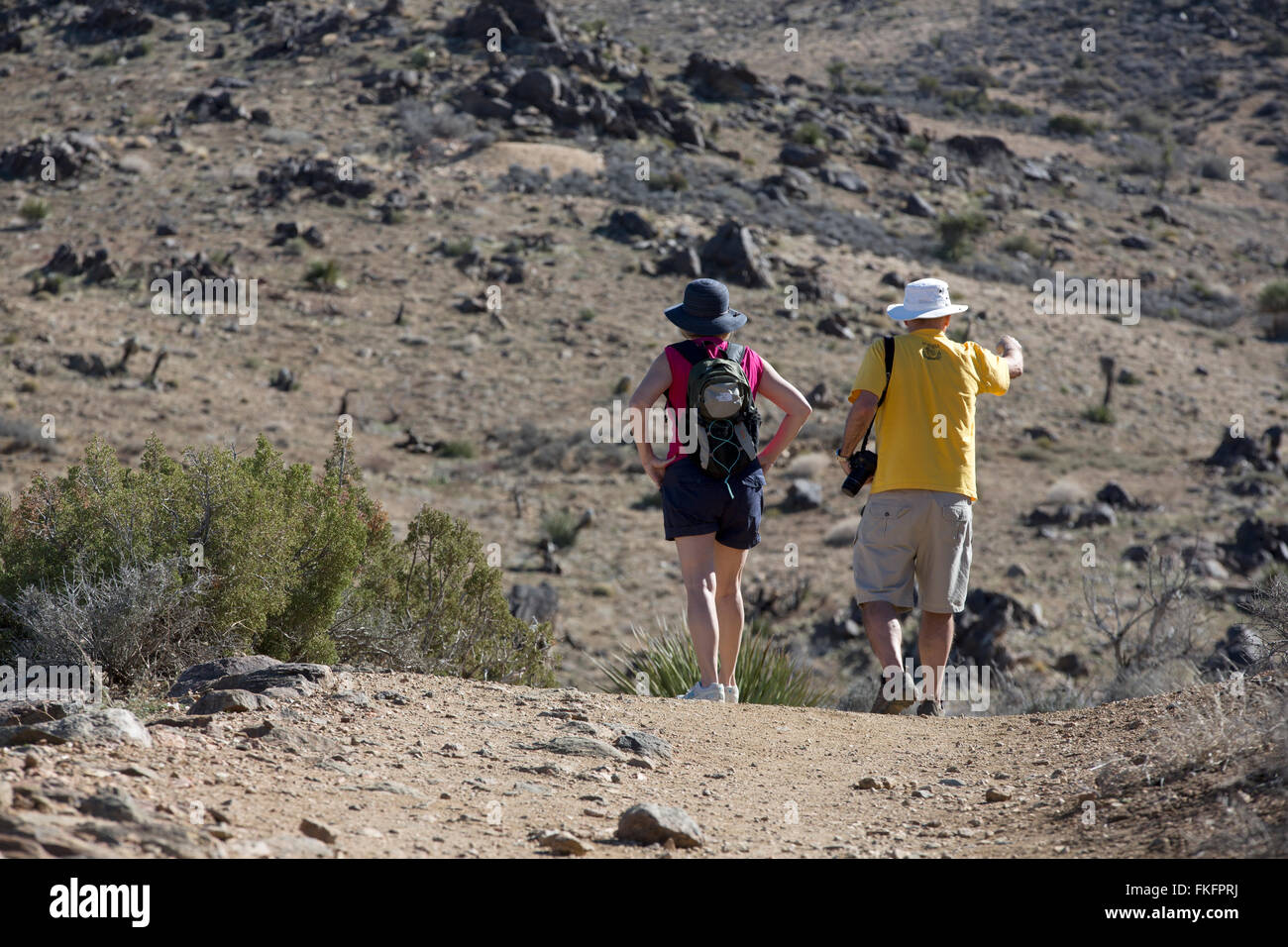 Couple hiking on the Lost Horse Mine trail, Joshua Tree National Park, California, USA Stock Photo