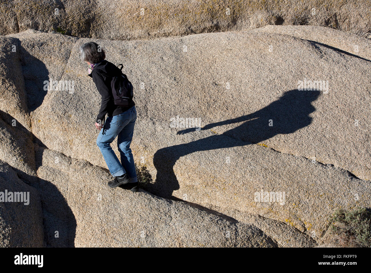 Woman hiking, Jumbo Rocks, Joshua Tree National Park, California, USA Stock Photo