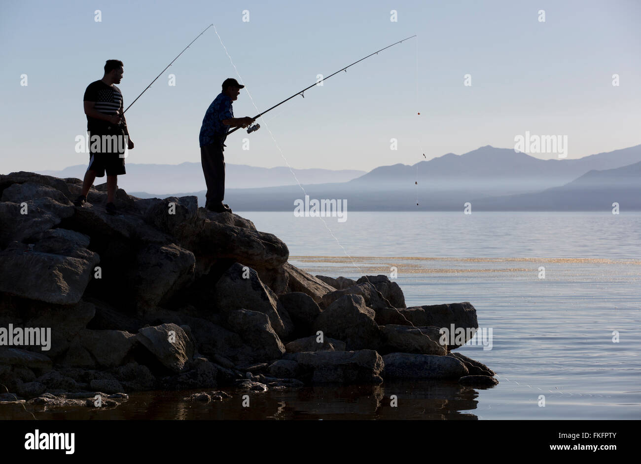 Men fishing, Salton Sea, California, USA Stock Photo