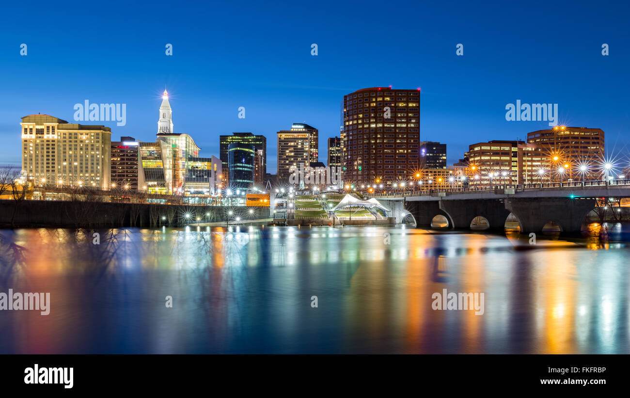 Hartford skyline and Founders Bridge at dusk. Hartford is the capital of Connecticut. Stock Photo